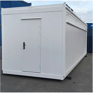 White container outside a factory with a white steel security door on the front of it